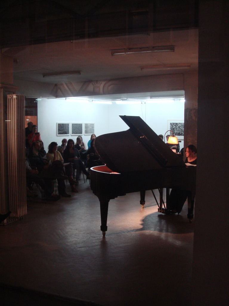 Judit Polgar at the grand piano, with drawings by Sam Porrit and an installation by Petra Köhle and Nicolas Vermot Petit-Outhenin, Perla-Mode, Zurich